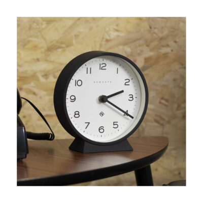 Close up of contemporary M Mantel by Newgate World in silicone black on a table