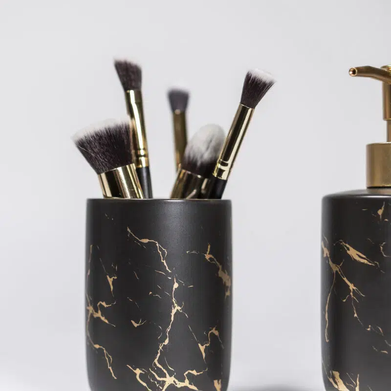 QUVIO Tandenborstelhouder met zeepdispenser – Zwart met goud