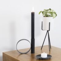 Zwarte onderzetter voor waxine licht