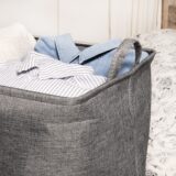 Grijze wasmand met handvaten